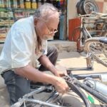 Roadside cycle repair shop owner