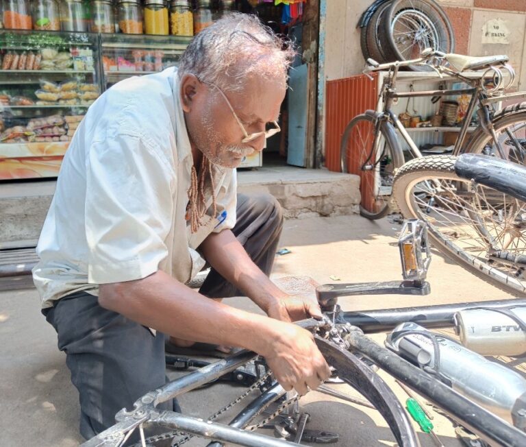 Roadside cycle repair shop owner