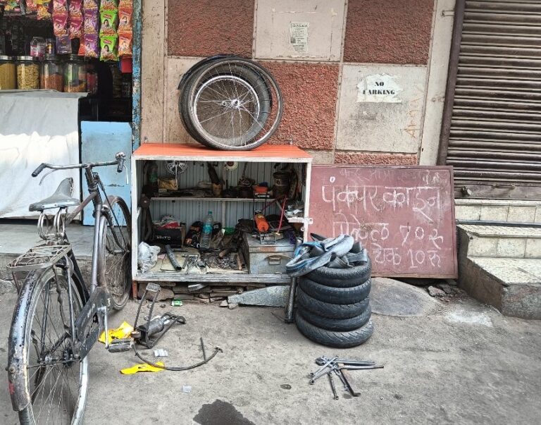 Roadside cycle repair shop owner